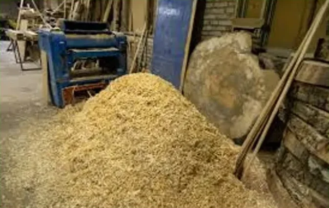 Before: sawdust and offcuts from a Siem Reap carpentry workshop